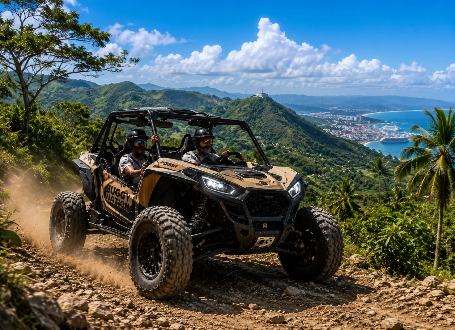 A Buggy Nation vehicle climbing a mountain track above a tropical bay.
